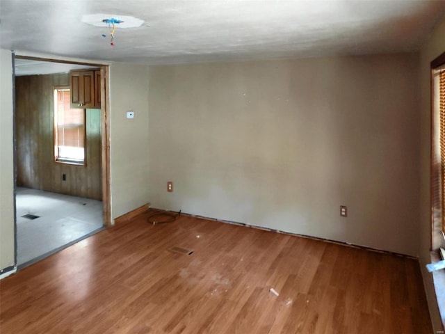 empty room with visible vents and wood finished floors