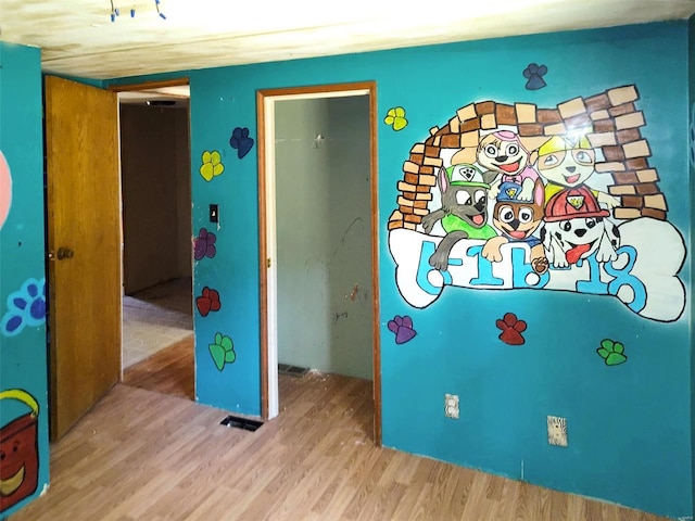 game room with light wood-style flooring