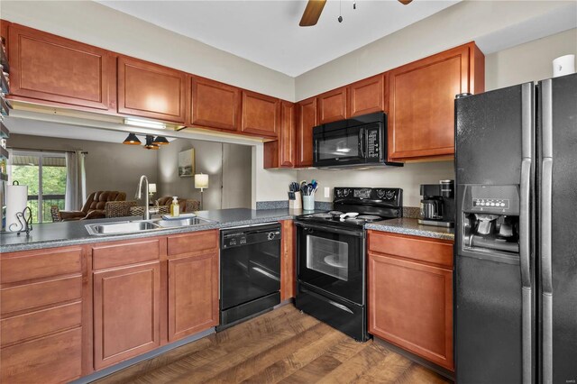 kitchen with black appliances, ceiling fan, sink, and dark wood-type flooring