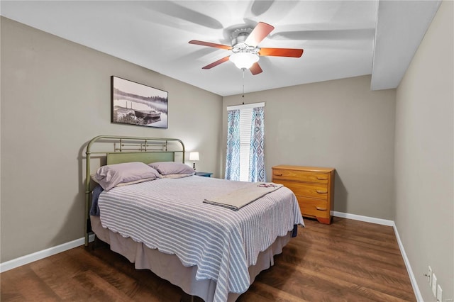 bedroom with ceiling fan and dark hardwood / wood-style flooring