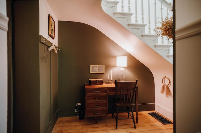 office with light wood-type flooring