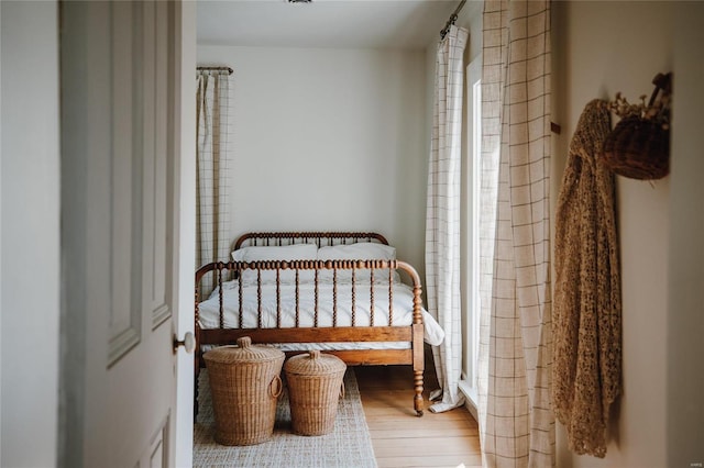 bedroom with hardwood / wood-style floors