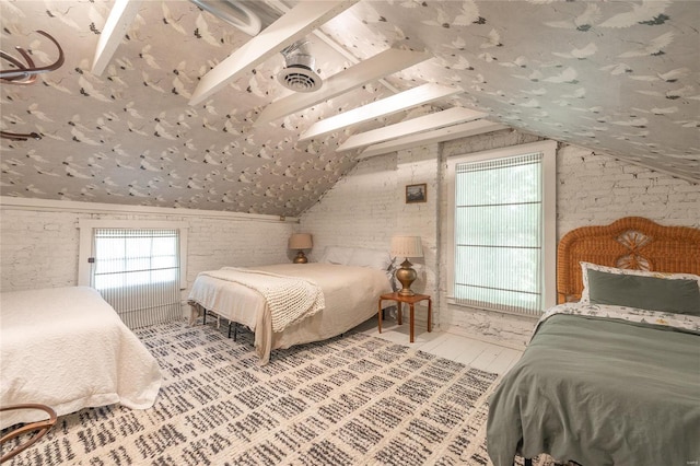 bedroom with brick wall, light wood-type flooring, and lofted ceiling with beams