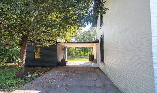 view of side of property with a patio area