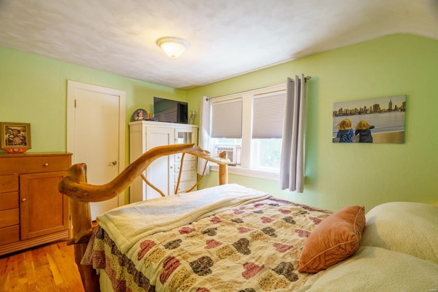 bedroom with hardwood / wood-style floors