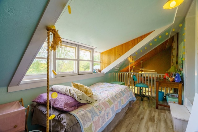 bedroom featuring vaulted ceiling and hardwood / wood-style flooring