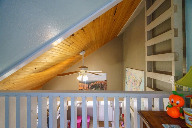 details featuring built in shelves, ceiling fan, and wooden ceiling