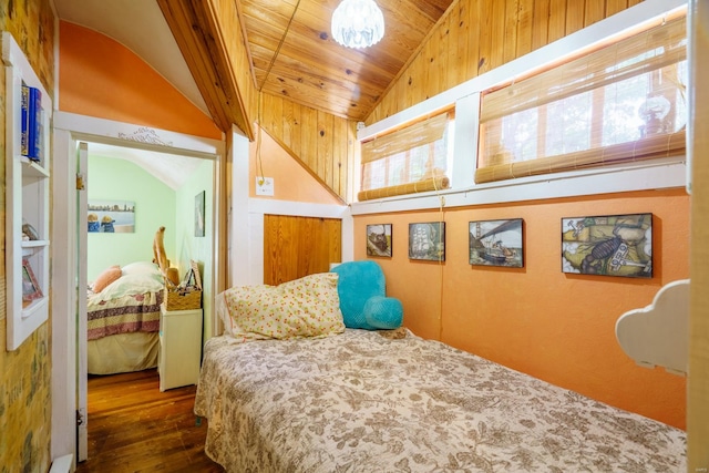 bedroom with lofted ceiling, dark wood-type flooring, and wood ceiling