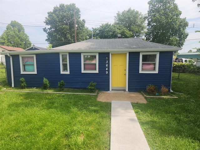 single story home featuring a front yard