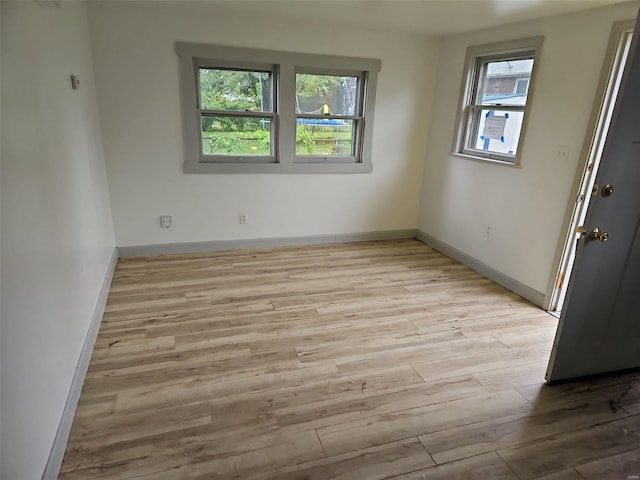 unfurnished room featuring light hardwood / wood-style flooring