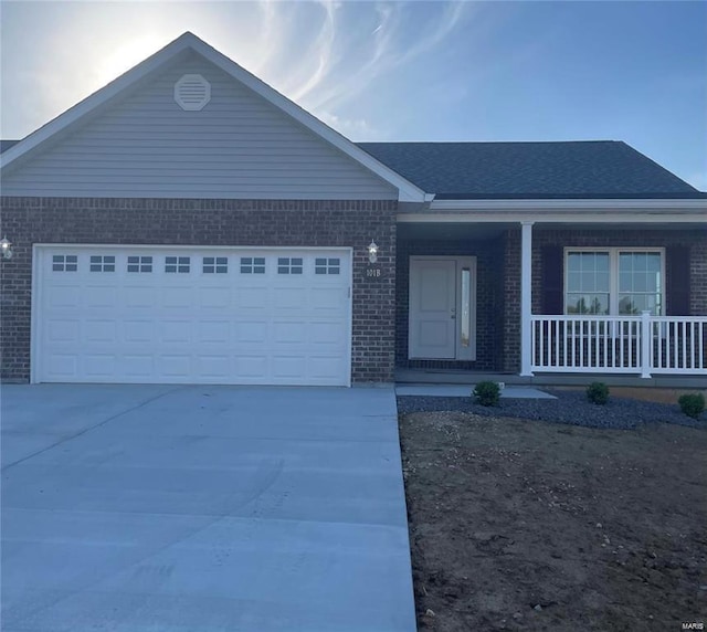 ranch-style house featuring a garage and a porch