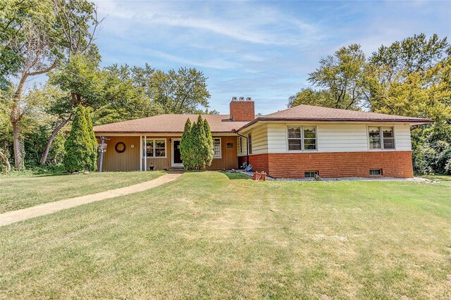 ranch-style house with a front lawn