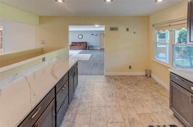 kitchen with recessed lighting, visible vents, light wood finished floors, and baseboards