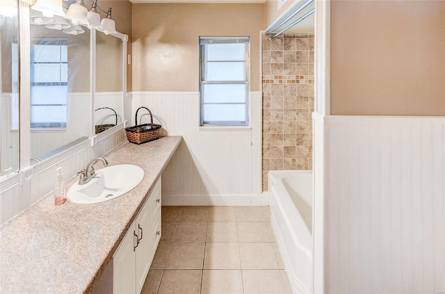 bathroom with  shower combination, tile patterned flooring, vanity, and wainscoting