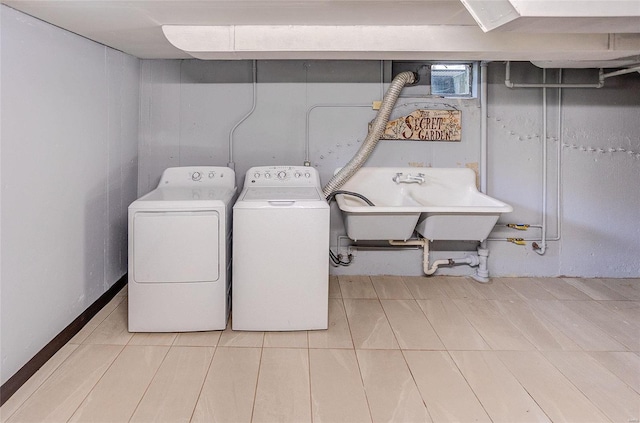 laundry room featuring laundry area, a sink, and washer and dryer