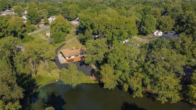 aerial view featuring a water view and a forest view