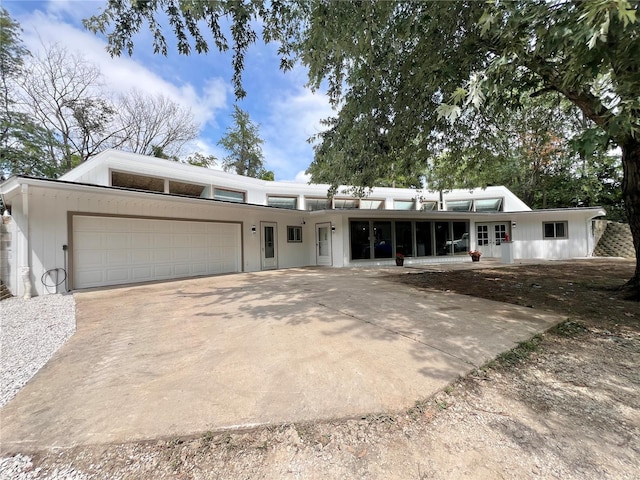 single story home with a garage