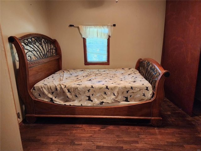 bedroom featuring wood finished floors