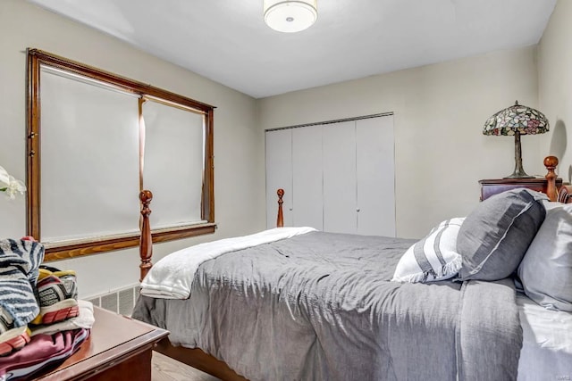 bedroom featuring hardwood / wood-style flooring and a closet