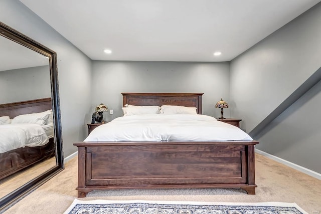 bedroom with light carpet