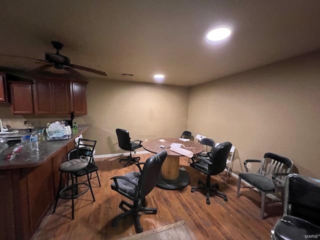 office space with light hardwood / wood-style flooring and ceiling fan