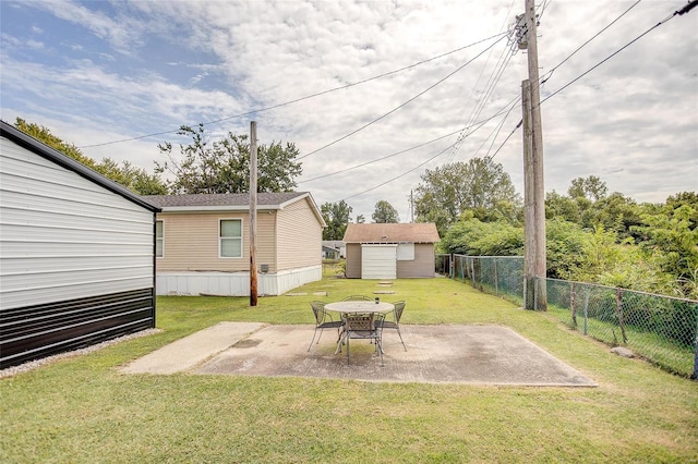 view of yard featuring an outdoor fire pit, a patio, and a shed