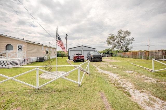 view of yard with an outdoor structure and a garage