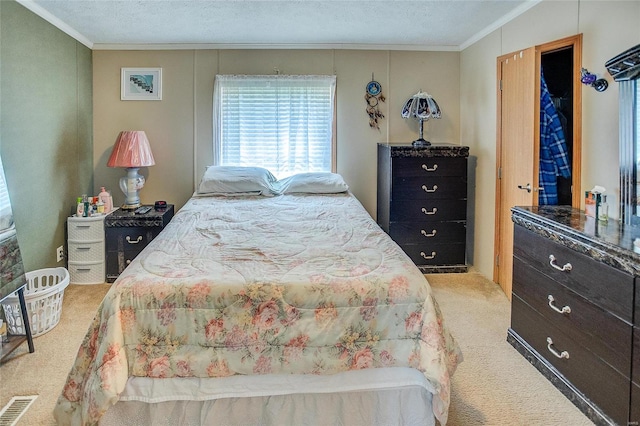 carpeted bedroom featuring a textured ceiling and crown molding