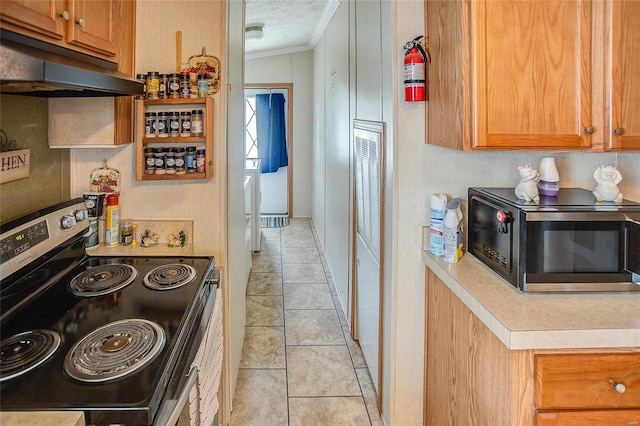 kitchen featuring ornamental molding, range with electric cooktop, a textured ceiling, lofted ceiling, and light tile patterned flooring