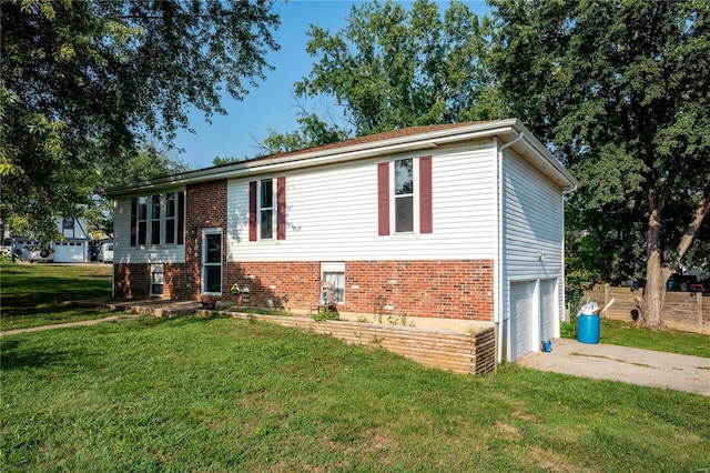 raised ranch with a garage and a front yard