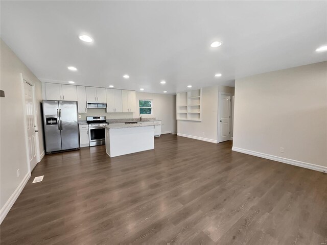 unfurnished living room with dark hardwood / wood-style floors and sink