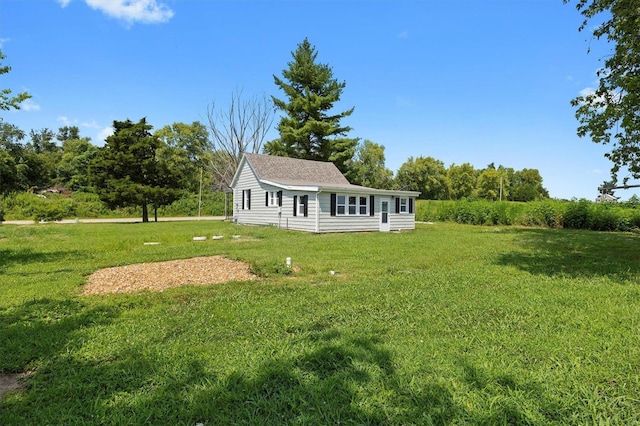 rear view of house with a lawn