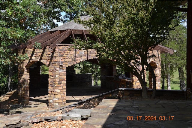 view of side of home featuring a patio area