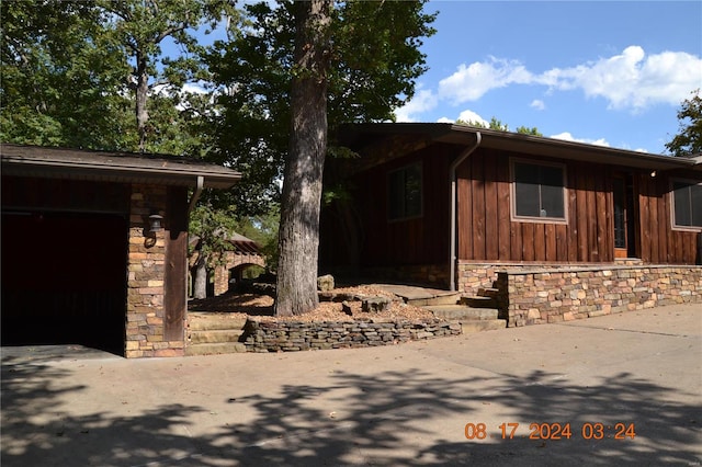 view of property exterior featuring a garage