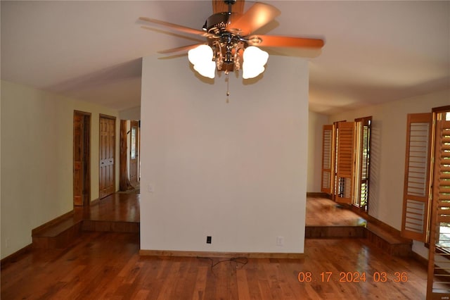 spare room with ceiling fan and hardwood / wood-style floors