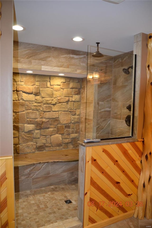 bathroom with tiled shower