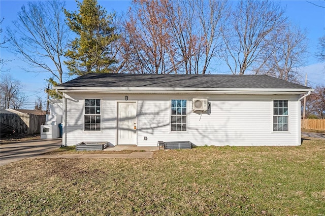 exterior space featuring ac unit and a yard