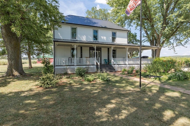 farmhouse-style home featuring a porch, an attached carport, and a front yard