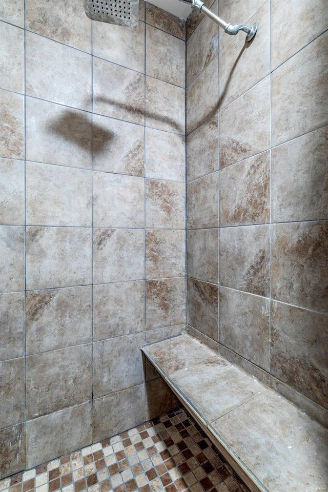 bathroom with a tile shower