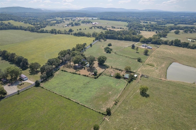 drone / aerial view featuring a rural view and a water and mountain view