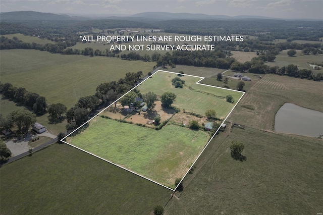 birds eye view of property with a rural view and a mountain view