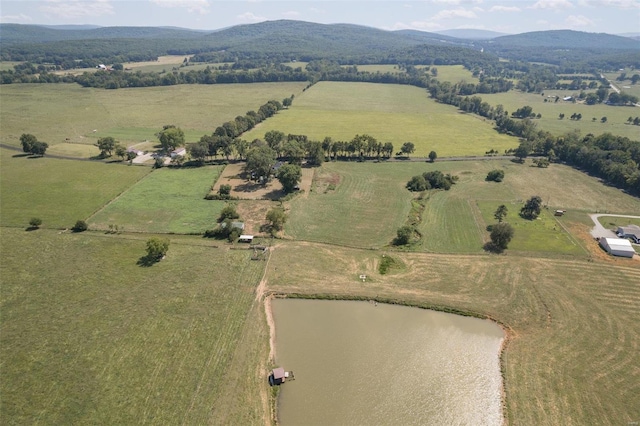 drone / aerial view featuring a water and mountain view and a rural view