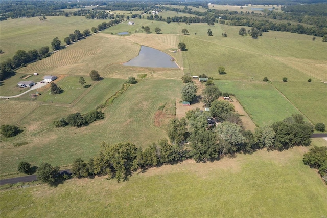 birds eye view of property featuring a water view and a rural view