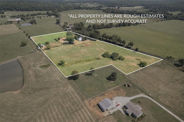 birds eye view of property featuring a rural view