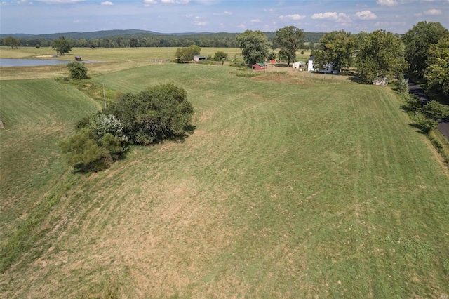 drone / aerial view with a rural view and a water view