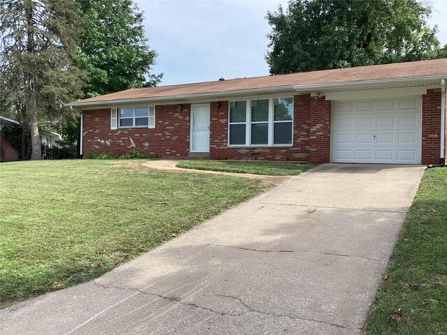 single story home with a front lawn and a garage