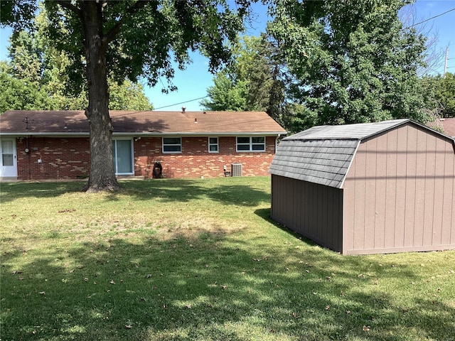 view of yard with a storage unit and cooling unit