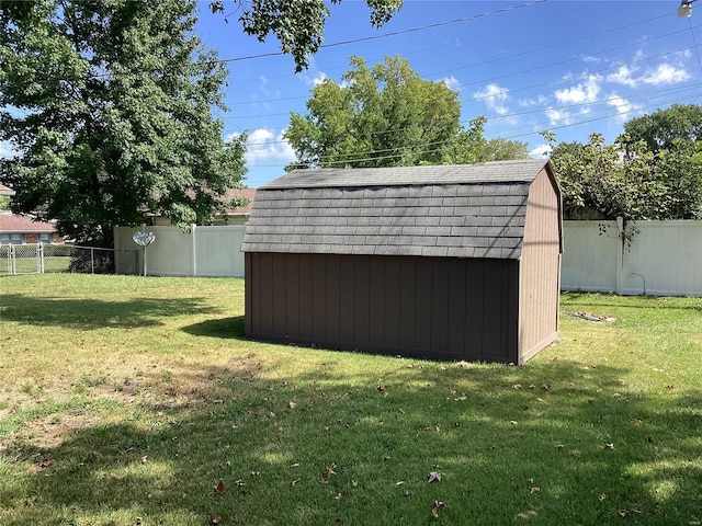 view of outbuilding featuring a lawn