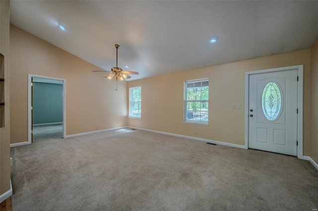 entryway featuring high vaulted ceiling, ceiling fan, and light colored carpet