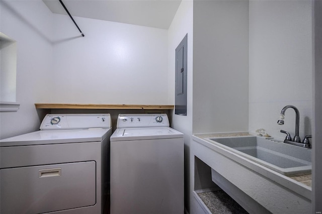 washroom featuring electric panel, sink, and independent washer and dryer